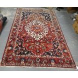 Persian Bahktiari rug, the hand knotted rug with central floral medallion within all over floral