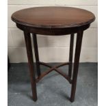 Early 20th century oval mahogany occasional table on square supports with X understretchers. W.53cm.