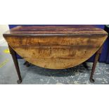 18th century oval oak drop leaf dining table on turned tapered supports with pad feet. W.118cm.
