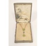 Gold pendant with circular peridot dependant by a zircon from another, Wheatley case, c1900. 3g