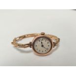 9ct gold cased 15 jewel ladies watch on 9ct gold expandable bracelet. case made by the City Watch