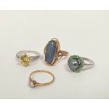 Gold ring with oval opal doublet, another cubic zirconia and two silver rings. (4).