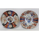 Two Japanese Meiji period Imari chargers of lobed circular form, the central circular panels of