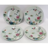 Set of four 18th century Chinese porcelain plates decorated with flowers and rocks in the famille