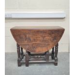 17th century oak oval small drop leaf dining table on turned baluster supports and