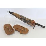 Pair of vintage Japanese wooden "Geta" sandals, each 21cm high and a printed cotton parasol with