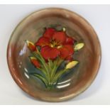 Walter Moorcroft "Freesia" pattern circular plate with flambe glaze, impressed mark with painted