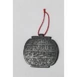 Antique Mughal black hardstone amulet of oval panel form, each side incised with rows of script, 6.