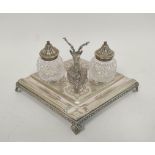 Victorian e.p. inkstand of lozenge shape with engraved scrolls and two cut glass receivers