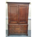 Early 19th century oak press cupboard with moulded pediment above pair of single panel cupboard