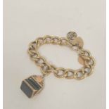 Gold hollow curb bracelet with rotating seal and two charms, 42g gross.