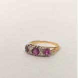Half hoop ring with three rubies and small diamond brilliants in gold '18ct'.