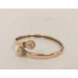 9ct gold bangle with fluted ball terminals, 8g.