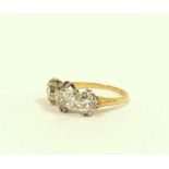 Fine diamond three stone ring the central brilliant 8mm, (approximately 1.5ct), faceted girdle,