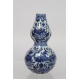 Antique Chinese Ming style blue and white porcelain vase of double gourd form with underglaze blue