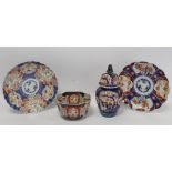 Four pieces of Japanese Imari porcelain, comprising: a small octagonal bowl, 14cm diam.; a covered