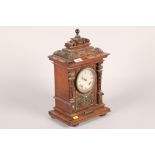 Late Victorian  carved oak cased mantle clock with brass mounts; raised on bun feet; 44cm high