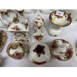 Nine pieces of Royal Albert Old Country Roses to include mantle clock; bell and vases