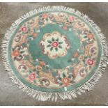 Chinese green ground circular rug; together with a modern beige ground rug