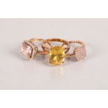 Three 9 carat rose gold gem set rings; 11.6g