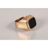 9 carat yellow gold and black hardstone set ring; 10.8g