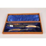 Horn handled three piece carving set; in fitted box