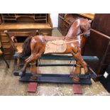 Painted hardwood Rocking horse; on turned trestle supports