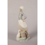 Lladro porcelain figure of a lady with a goose drinking from a bucket