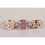 Three 9 carat yellow gold gem set dress rings; 12.8g