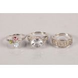 Three 9 carat white gold gem set rings; 12.5g