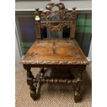 19th century carved oak chair; after an earlier design