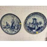 Two blue and white pottery wall hanging plates; each of Dutch theme