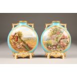 Pair 19th century Royal Worcester moon flask vases, powder blue with hand painted figures in