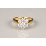 Ladies 18 carat yellow gold diamond daisy cluster ring, central stone 0.25 carats, surrounded by six
