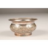 19th/20th century Chinese silver bowl, embossed floral decoration, character marks to base, 11cm