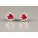 Pair of eighteen carat white gold ruby and diamond earrings, diamonds approximately 0.5 carats, ruby