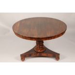 Victorian rosewood tip up breakfast table, circular top, supported on a tapered column raised on a