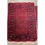 Persian rug, red ground with blue and cream geometric lozenges, length 172cm, width 122cm