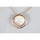 18 carat gold circular pendant with a circular mother of pearl disc and a diamond set gold hoop