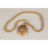 Yellow metal locket pendant, with mounted diamonds on an 18 carat yellow gold rope twist chain,