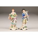 Pair of 19th century German porcelain figures, gentleman holding a goat and a lady with a basket