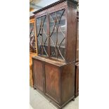 19th century mahogany bookcase, plain cornice over a pair of astragal glass doors above twin