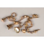 9 carat gold watch chain, with assorted fobs and charms, 32g