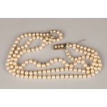 Ladies double strand pearl necklace, with white metal diamond set clasp, 0.33 carats