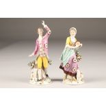 Pair 19th century English porcelain figures, gentleman and lady dancing, each with a lamb at their