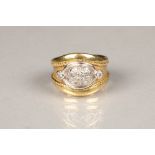 18 carat gold broad band, with an oval cluster of diamond chips flanked either side with 0.03