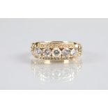 Five stone diamond ring, five 0.2 brilliant cut diamonds with a row of tiny diamonds above and below