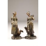 After Guiseppe D'Aste A pair of Bronze figures of Dutch farming women Signed D'Aste M/5 1495 & A 7/