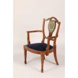 Edwardian mahogany open armchair, central panel hand painted with cherub holding flowers, with