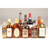 Eight assorted bottles of whisky, two bottles of port and a cognac including: Bells blended scotch